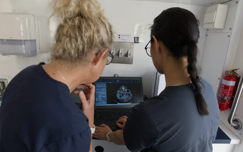 Picture of Dr Leanne Versteege and Dr Lisa Muscat examining CT scan